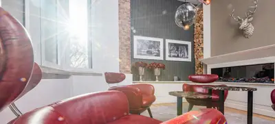 Foto von SATELLITE OFFICE Girardet Haus Königsallee - Kaminlounge „Girardet“